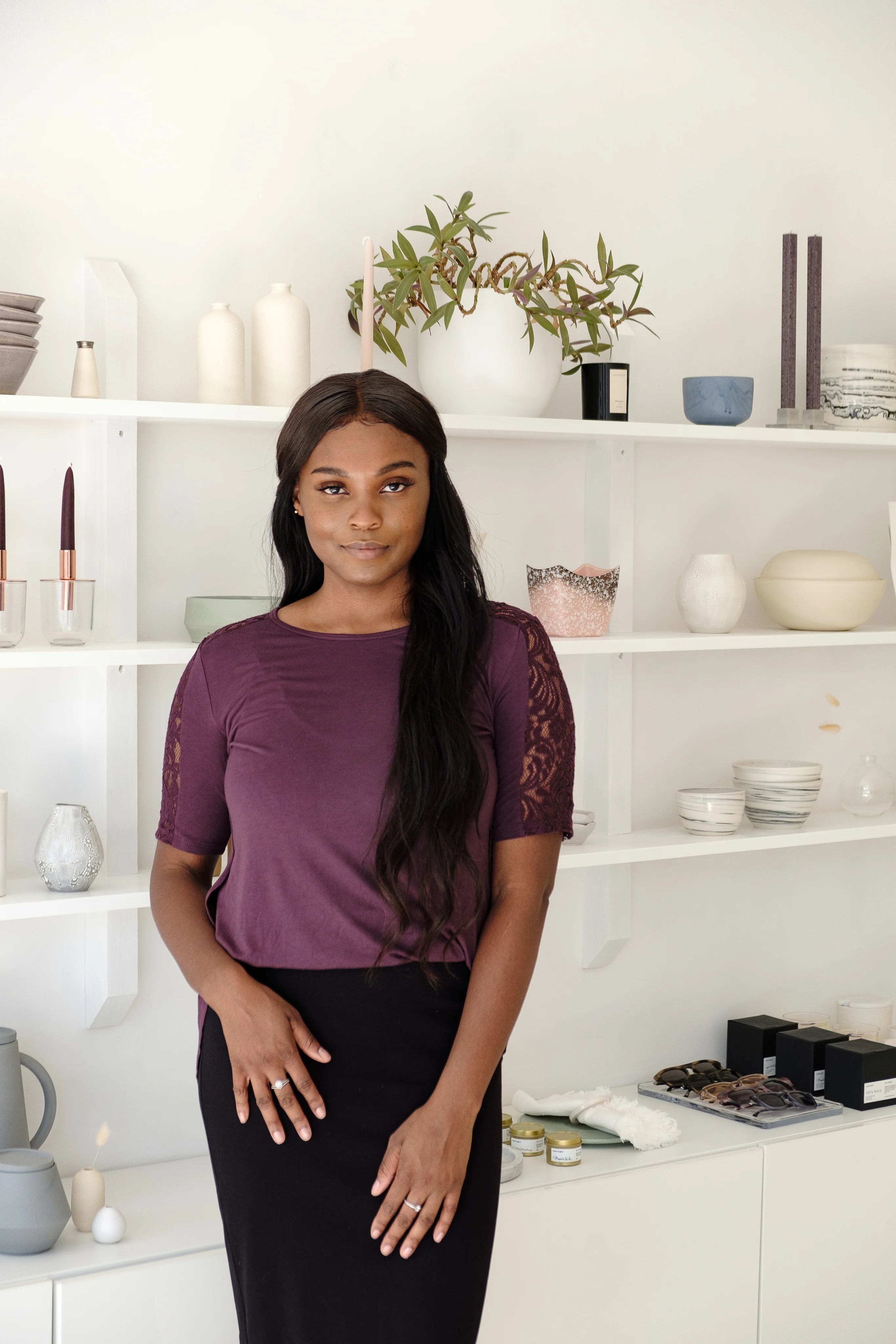 files/young-model-stands-in-front-of-shelf.webp